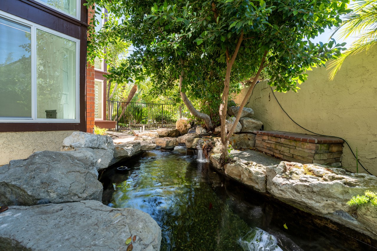 besides having a pool and spa, this home features a grand custom koi pond made from natural boulders and recently re-piped and modernized.